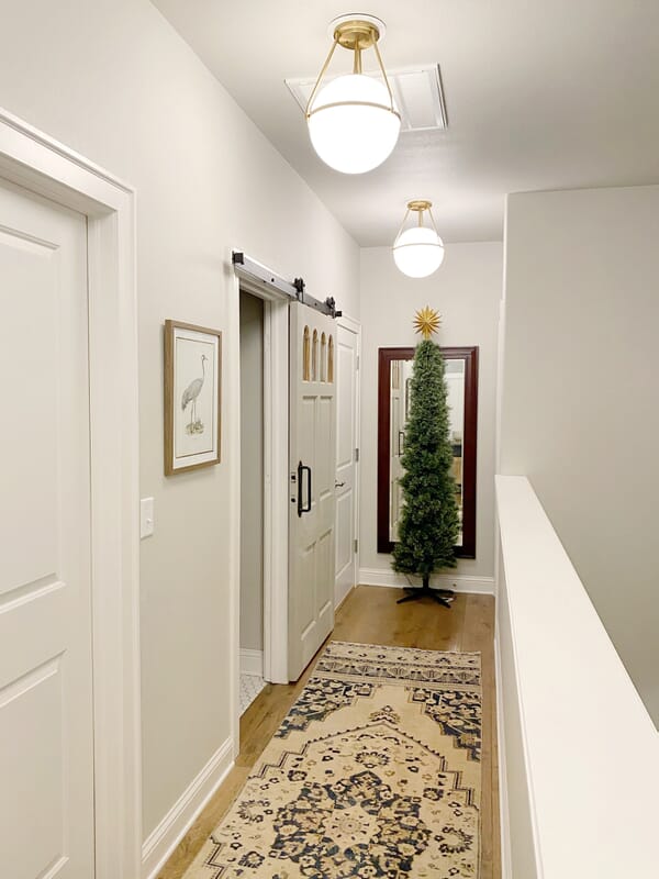 Light your secondary spaces, like hallways, so guests can get around.