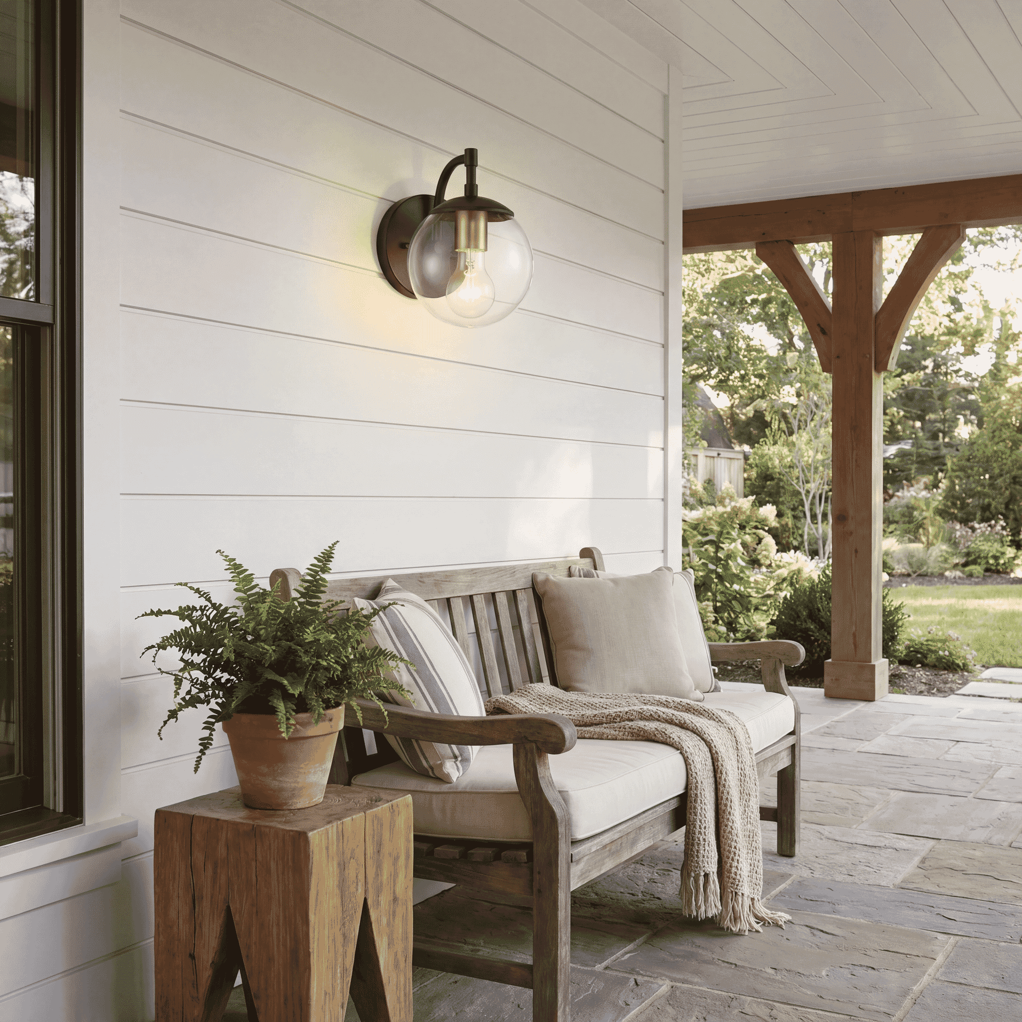 Trade Winds Lighting 1-Light Wall Sconce In Oil Rubbed Bronze With Brass Accents