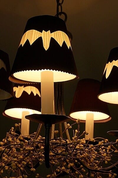 Make little cutouts to fit over the shades on your chandelier! See more on LightsOnline Blog.
