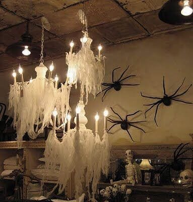 Get this ghostly chandelier look with cheesecloth! Learn more on LightsOnline.com Blog
