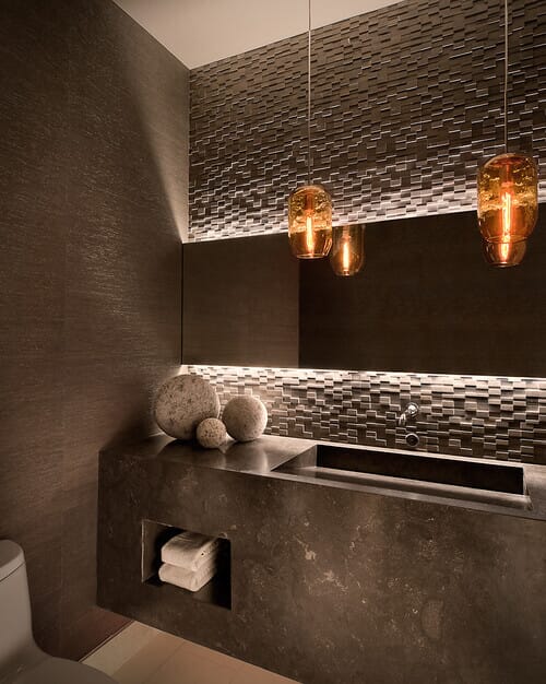 Go totally dramatic with your powder room lighting. LED tape helps create glowing effects. Photo credit: Contemporary Powder Room by Scottsdale Interior Designers & Decorators Ownby Design