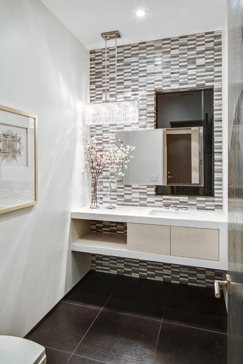 A beautiful crystal linear light like the Access Magari puts a new spin on powder room lighting. Photo credit: Contemporary Powder Room by Encino Home Builders Boswell Construction