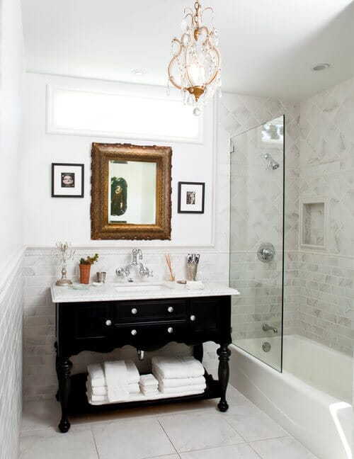 Add a mini chandelier to your bathroom for a glam look! Photo credit: Traditional Bathroom by Thousand Oaks General Contractors JRP Design & Remodel