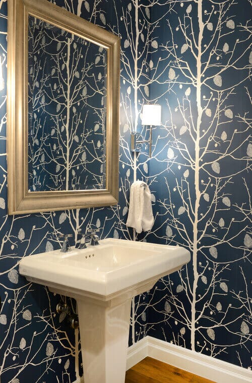 Slim sconces like the Savoy House Monroe are a smart choice for powder room lighting. Photo credit: Transitional Powder Room by Denver Interior Designers & Decorators Ashleigh Weatherill Interior Design