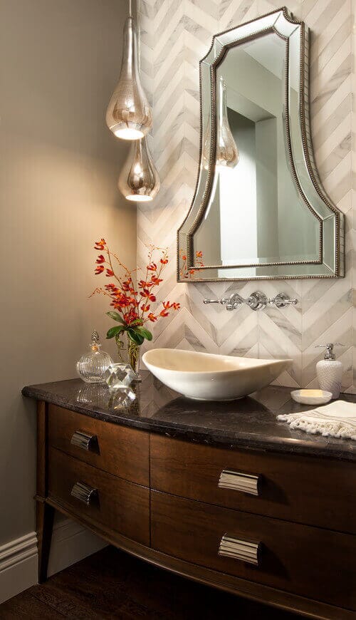 Curvy pendants like the Arteriors Arianna would be a great addition to your powder room lighting. Photo credit: Transitional Powder Room by San Diego Interior Designers & Decorators Robeson Design