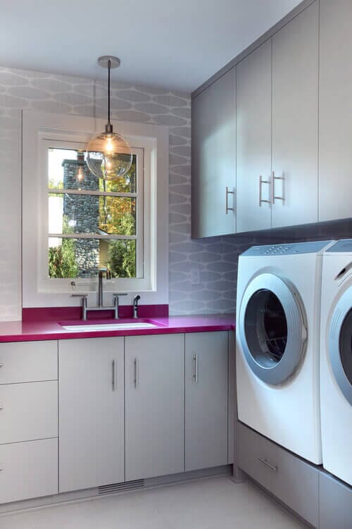 Make your laundry room pop with a peppy pendant light. Photo credit: Contemporary Laundry Room by Grand Rapids Architects & Designers Visbeen Architects