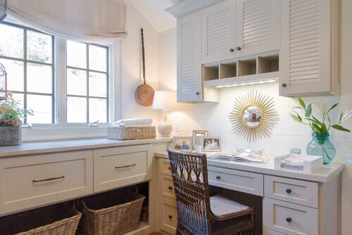A table lamp is a surprising but smart addition to laundry room lighting. Photo credit: Traditional Laundry Room by Atlanta Interior Designers & Decorators Jessica Bradley Interiors